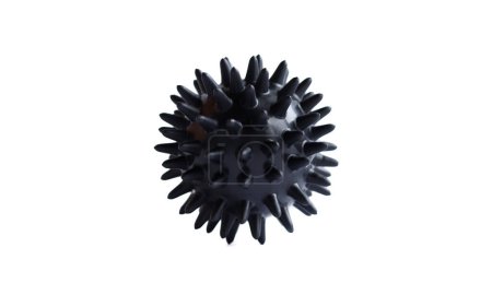 A black myofascial ball isolated on a white background. Concept of physiotherapy or fitness.