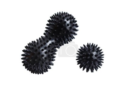 Massage set - A black myofascial spiky body ball and double peanut roller with studs. Concept of physiotherapy or fitness.