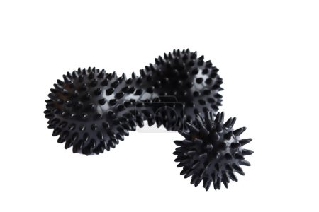 Massage set - A black myofascial spiky body ball and double peanut roller with studs. Concept of physiotherapy or fitness.