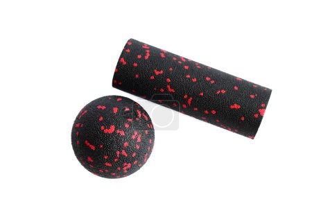 Photo for Massage set: A black red ball and mfr massage mini roller isolated on a white background. Close-up. Foam rolling is a self myofascial release technique. Concept of fitness equipment. - Royalty Free Image
