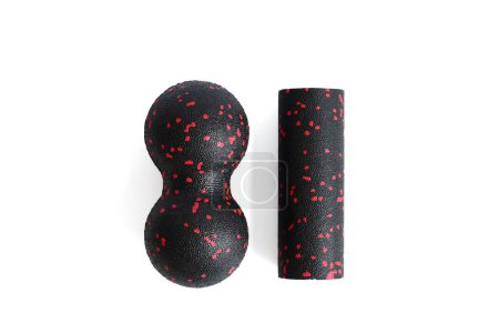 Photo for Massage set: A black red double ball and mfr massage mini roller isolated on a white background. Close-up. Foam rolling is a self myofascial release technique. Concept of fitness equipment. - Royalty Free Image