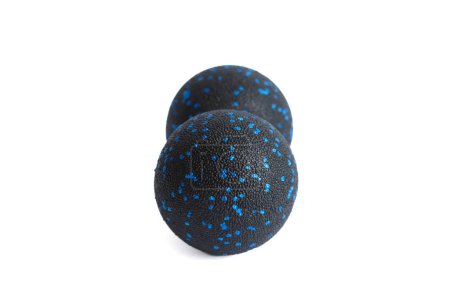 Black double ball or peanut ball massager with blue dots isolated on a white background. Fitness equipment. Concept of myofascial release.