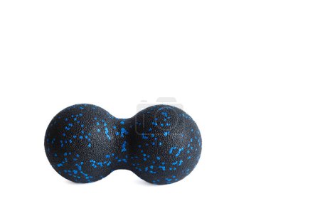 Black double ball or peanut ball massager with blue dots isolated on a white background. Fitness equipment. Concept of myofascial release.