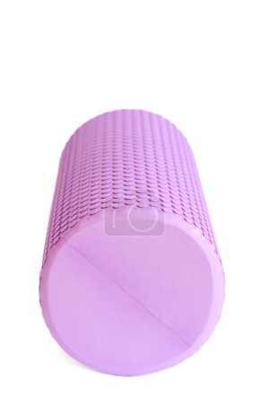 A purple massage foam roller isolated on a white background. Close-up. Foam rolling is a self myofascial release technique. Concept of fitness equipment.