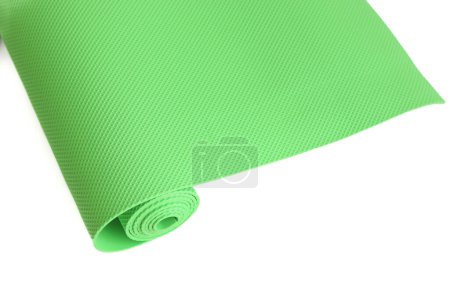 Photo for A green yoga mat isolated on a white background. oncept of fitness equipment. - Royalty Free Image