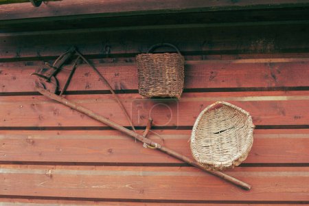Photo for Old peasant tools hanging on wooden wall on animal farm. High quality photo - Royalty Free Image