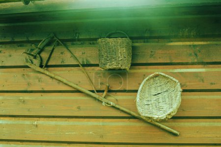 Photo for Old peasant tools hanging on wooden wall on animal farm. High quality photo - Royalty Free Image