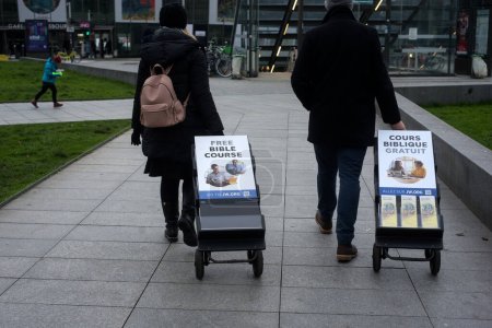 Téléchargez les photos : Strasbourg - France - 21 January 2023 - Portrait on back view of Jehovah witnesses standing in the street - en image libre de droit