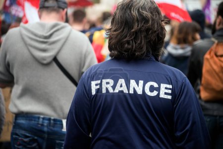 closeup of Man walking in the street with France tee- shirt