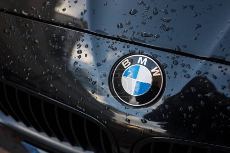 Photo for Mulhouse - France - 24 march 2024 - closeup of rain drops on bmw logo in front car parked in the street - Royalty Free Image