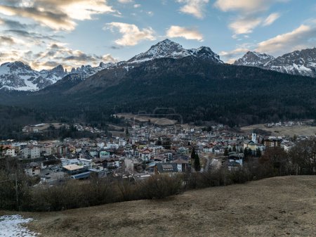 Photo for Aerial drone view of Andalo town with mountains background in winter. Ski resort Paganella Andalo, Trentino-Alto Adige, Italy., Italian Dolomites,.Pagnella valley. Snow covered Italian Dolomites at winter. - Royalty Free Image