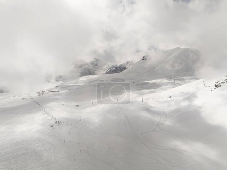 Aerial drone view of Gudauri ski resort in winter. Caucasus mountains in Georgia. Kudebi, Bidara, Sadzele, Kobi aerial panorama in caucasus winter mountains.