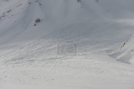 Freeride rally traces on powder snow. Kudebi, Bidara, Sadzele, Kobi aerial panorama in caucasus winter mountains. Aerial drone view of Gudauri ski resort in winter. Caucasus mountains in Georgia