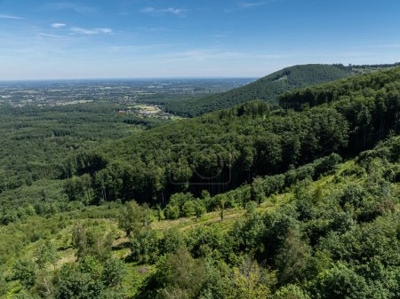 Drone view in Beskid mountains, Blatnia. Summer green forest on Blatnia. Beskid mountains in Jaworze. Drone fly above green mountains in summer. Polish green mountains and hills aerial drone photo