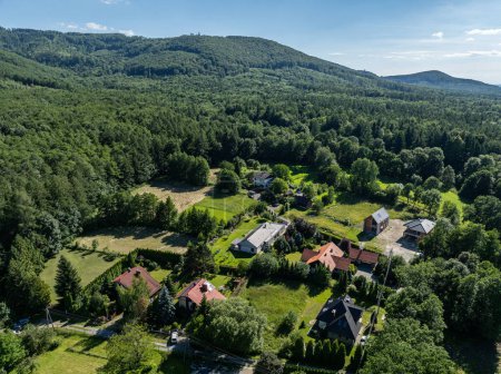 Summer green forest in Jaworze. Drone view in Beskid mountains. Beskid mountains in Jaworze. Drone fly above green mountains in summer. Polish green mountains and hills aerial drone photo