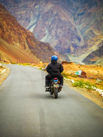 Photo for Ladakh, India - June 26, 2022 : Bikers enjoying beautiful scenic view between Diskit and Khardung La Pass in Nubra Valley, Leh Ladakh, Jammu and Kashmir, India. - Royalty Free Image