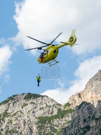 Photo for Fiames, Cortina d'Ampezzo, Dolomites, Italy - July, 6,  2022 : Helicopter Rescue Service. Medical first aid helicopter. Dolomites. Alps. Italy. - Royalty Free Image