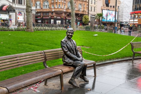 Photo for London, UK - March 22, 2024 : Statue of Mr Bean sitting on a bench. Rowan Atkinson bronze statue in London. UK. - Royalty Free Image
