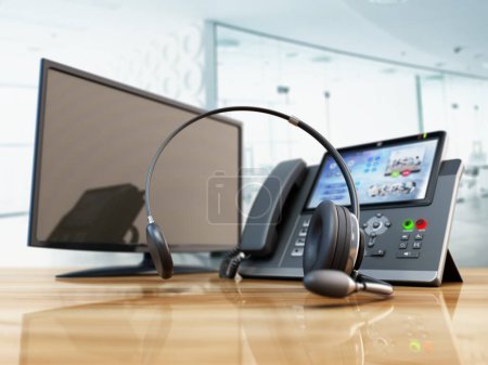 Foto de Moderno teléfono VoIP y auriculares de pie en la mesa de oficina de madera. Centro de llamadas, marketing y concepto de soporte técnico. Ilustración 3D. - Imagen libre de derechos