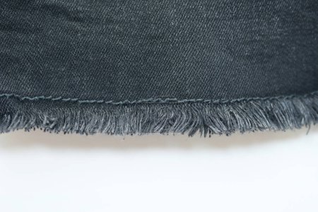 Foto de Textura danim negro sobre fondo blanco, textil de moda jeans para el diseño de ropa - Imagen libre de derechos