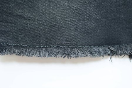 Foto de Textura danim negro sobre fondo blanco, textil de moda jeans para el diseño de ropa - Imagen libre de derechos