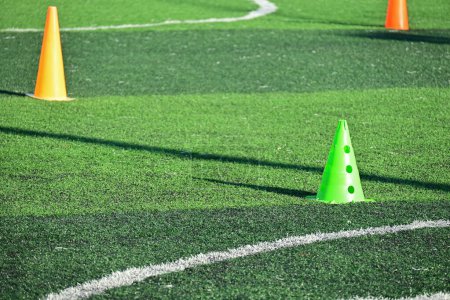 Photo for Artificial green grass soccer field with training cones - Royalty Free Image