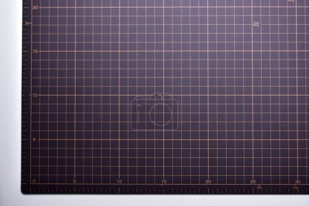 Photo for Black cutting mat board on white background with line and scale measure guide pattern for object art design, tool equipment of diy craft work - Royalty Free Image