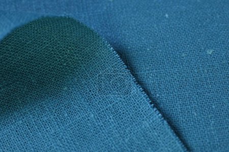 Foto de Azul verde cáñamo viscosa tela natural tela color, saco textura áspera del fondo abstracto de la moda textil - Imagen libre de derechos