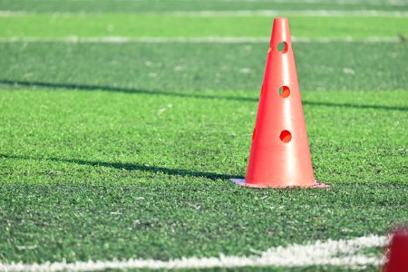 Photo for Artificial green grass soccer field with orange training cones - Royalty Free Image