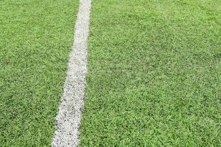 Photo for Artificial green grass turf sport soccer field with black rubber granules infill - Royalty Free Image