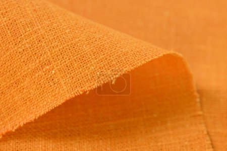 Foto de Naranja cáñamo viscosa tela natural tela color, saco textura áspera del fondo abstracto de la moda textil - Imagen libre de derechos