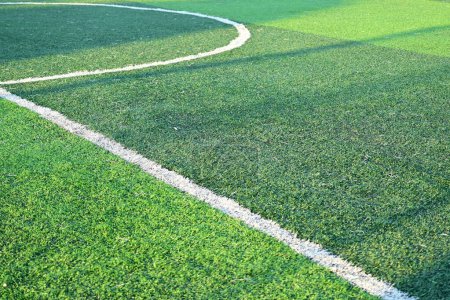 Photo for Artificial green grass soccer field with white line - Royalty Free Image