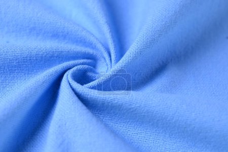 Foto de Textura de algodón azul color de la industria textil de la tela, imagen abstracta para el fondo de diseño de tela de moda - Imagen libre de derechos