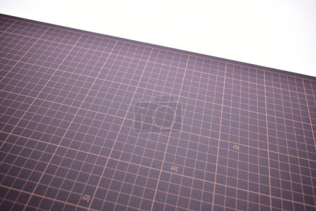 Photo for Black cutting mat board on white background with line and scale measure guide pattern for object art design, tool equipment of diy craft work - Royalty Free Image