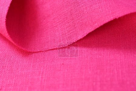 Foto de Rosa cáñamo viscosa tela natural tela color, saco textura áspera del fondo abstracto de la moda textil - Imagen libre de derechos