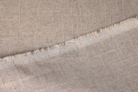 Foto de Cáñamo marrón viscosa tela natural, saco textura áspera del fondo abstracto de la moda textil - Imagen libre de derechos