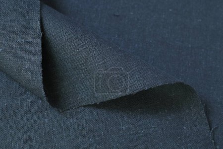 Foto de Cáñamo gris oscuro viscosa tela natural tela color; saco textura áspera de fondo abstracto moda textil - Imagen libre de derechos