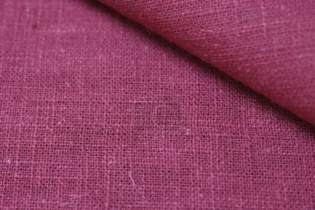 Foto de Cáñamo rojo viscosa tela natural tela color, saco textura áspera del fondo abstracto de la moda textil - Imagen libre de derechos