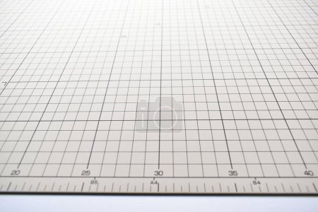 Photo for Gray cutting mat board background with line and scale measure guide pattern for object art design, tool equipment of diy craft work - Royalty Free Image
