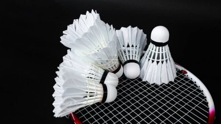 Photo for Badminton shutter cocks were put on the racket with dark background - Royalty Free Image