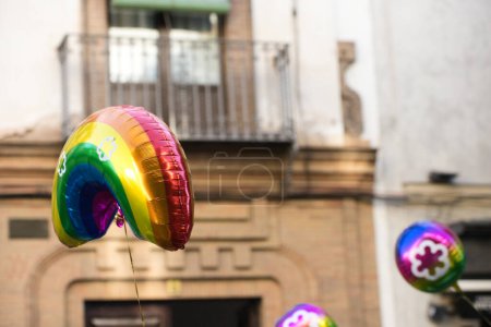 Balloons flying at the gay pride during the demonstration for the rights of homosexuals and LGBTQ people in the city of Seville, Spain. Concept of equality and gay rights