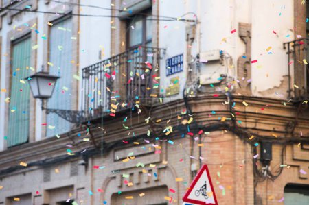 coloured confetti flying at the gay pride demonstration for gay and LGBTQ rights in the city of Seville, Spain. Concept of equality and gay rights