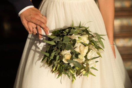 Photo for Beautiful wedding bouquet in the bride's hand - Royalty Free Image