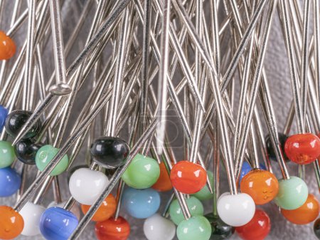 Photo for Background from sewing pins with multi-colored round heads - Royalty Free Image