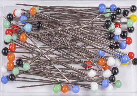 Photo for Many multi-colored sewing pins on a white background - Royalty Free Image
