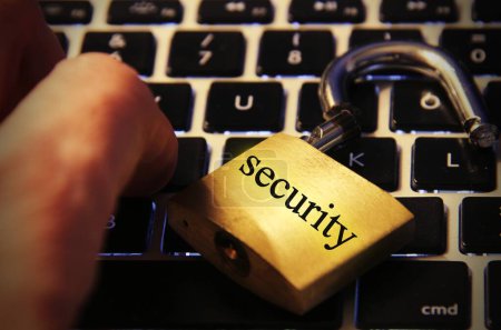 Photo for Security text on computer keyboard with open padlock - Royalty Free Image