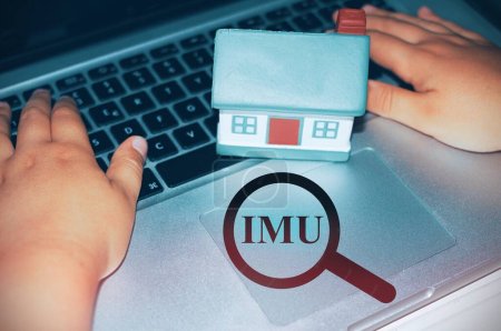 Photo for House with a magnifier with the text "Imu" italian tax - Royalty Free Image