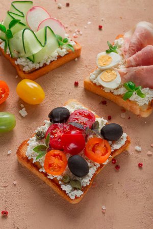 Photo for Breakfast, assortment of sandwiches, on white toast bread, top view, no people, - Royalty Free Image