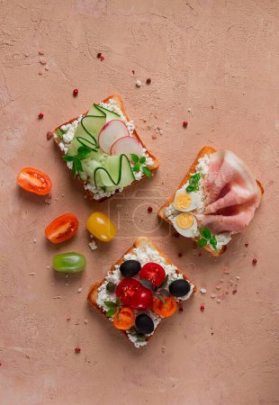 Photo for Breakfast, assortment of sandwiches, on white toast bread, top view, no people, - Royalty Free Image