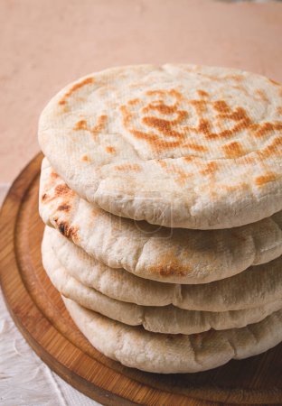 Pita bread, stack, on the table, no people,